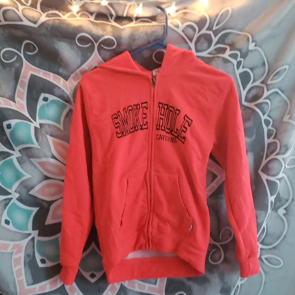 Bright orange smoke hole caverns zip up